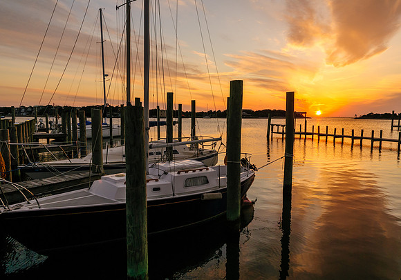 The sun sets over a tranquil Silver Lake harbor, Ocracoke, NC