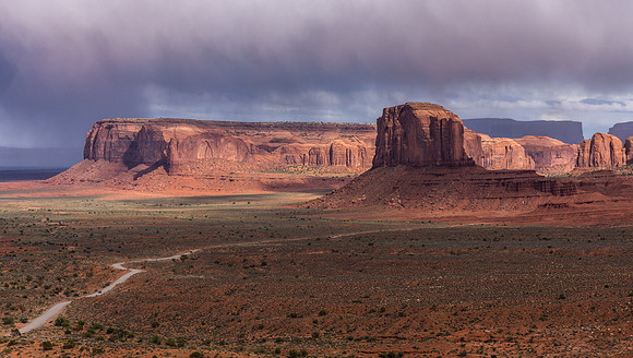 Afternoon storm clouds building over Merrick Butte and Spearhead Mesa. Monument Valley