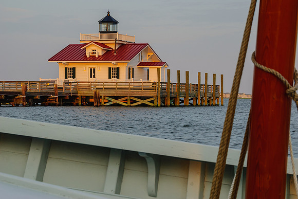 Marshes Light viewed through a hand-crafted wooden sail boat in Manteo, NC