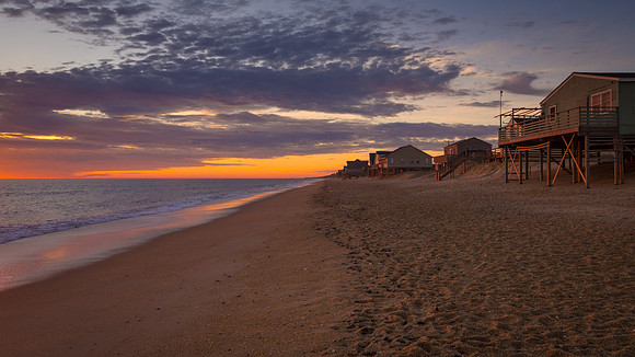 A golden glow greets the beach in Kitty Hawk