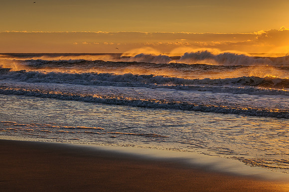 Rough seas and an offshore wind greet the sunrise on Ocracoke Island