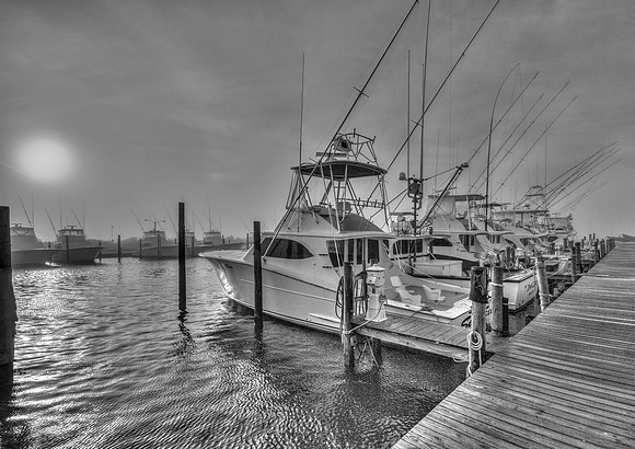 Sportfishing boats at dawn in Oregon Inlet Marina (B&W)